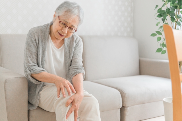 a woman with knee hurting